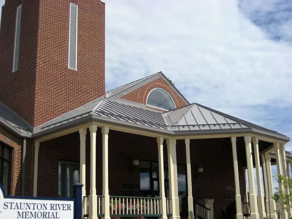 Skilled roofing craftsmen working on a residential roof in Tiverton